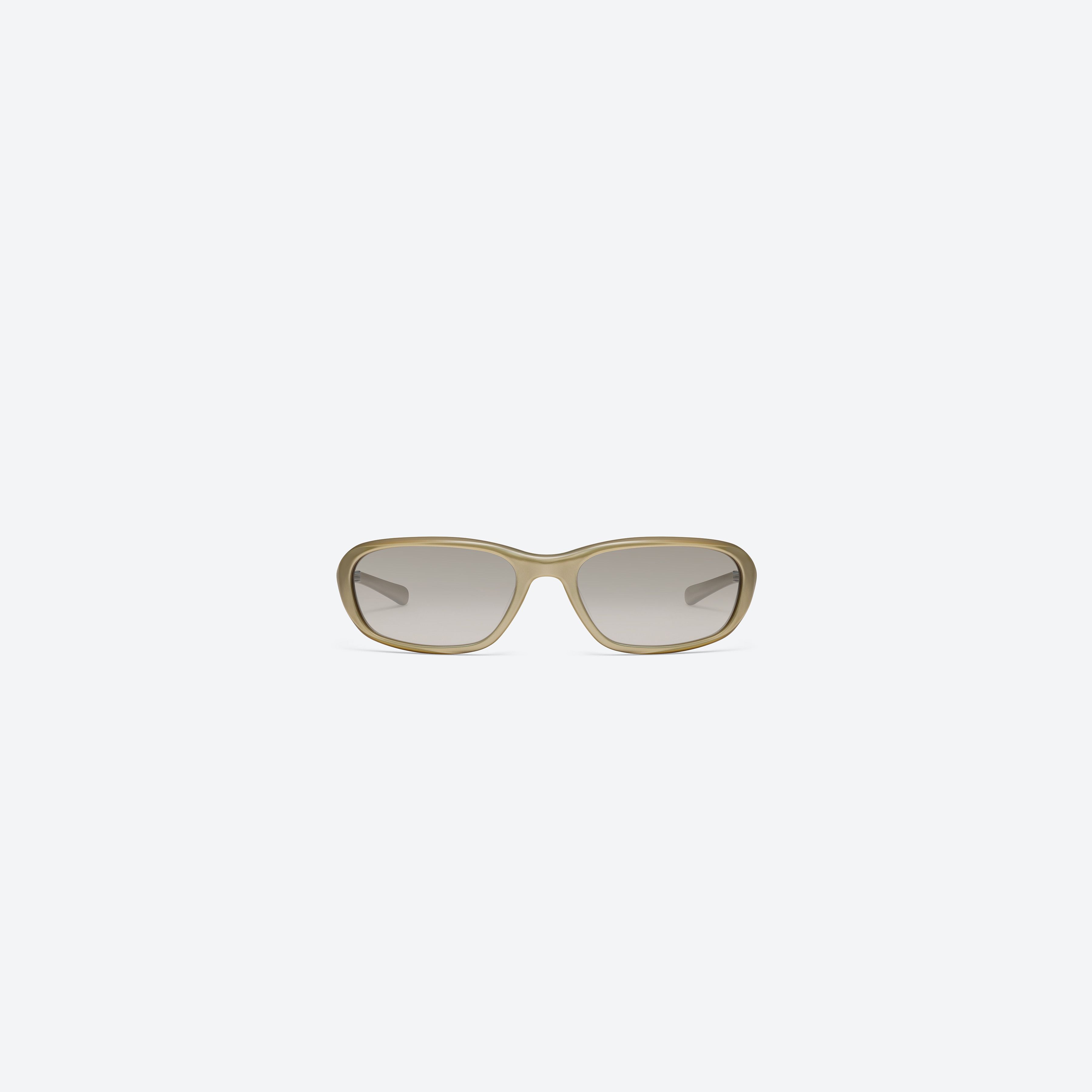 A front view of Gentle Monster Hills GDC2 Gold Acetate framed Wraparound sunglasses.